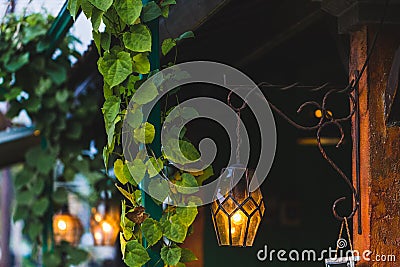 Old beautiful hanging lamp outside in cafe garden made from stained glass Stock Photo