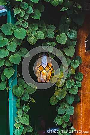 Old beautiful hanging lamp outside in cafe garden made from stained glass Stock Photo