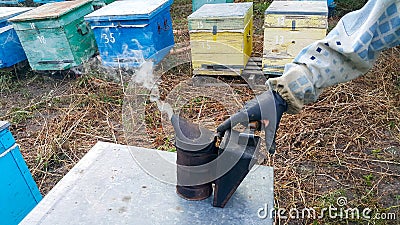 Old bee smoker. Beekeeping tool Stock Photo