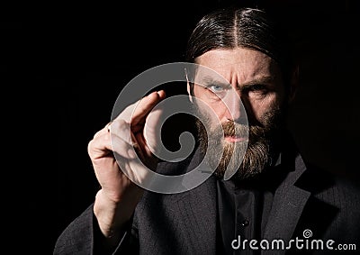 Old Believer Senior Prayer, bearded old man praying on a dark background Stock Photo