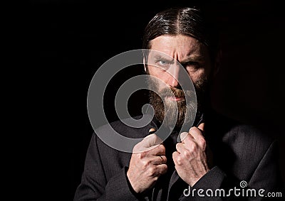 Old Believer Senior Prayer, bearded old man praying on a dark background Stock Photo