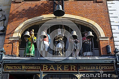 Old Bell and Bakers Clock in Gloucester, UK Editorial Stock Photo