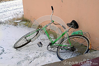 Old bicycle abandoned on a street Stock Photo