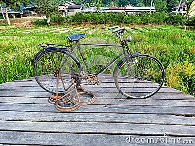 An old bicycle that is displayed and becomes a memory Editorial Stock Photo