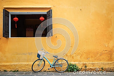 Old bicycle parked near house wall Stock Photo