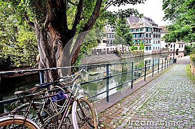 Old bicyles rested against a rail Stock Photo