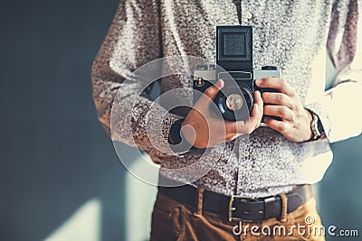 Old medium format camera in photographer hands Stock Photo