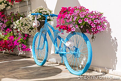 Old bike with floral decoration,Bodrum, Turkey. Stock Photo