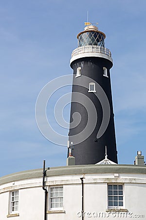 Old black Dungeness Lighthouse Stock Photo