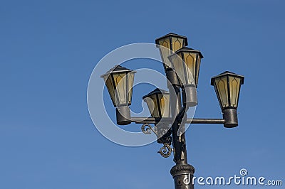Old black lantern on the background with blue sky Stock Photo