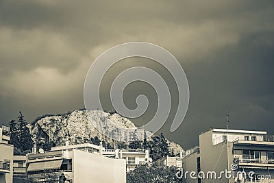 Dark black storm clouds over Greek city panorama Athens Greece Stock Photo