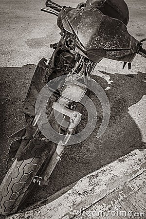 Old black broken dirty motorbike vehicle car scooter rusting Mexico Editorial Stock Photo