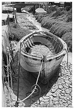 Old black and white wooden boat Stock Photo