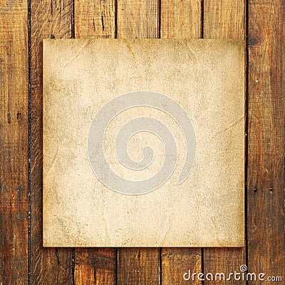 Old blank paper on brown weathered wooden background Stock Photo