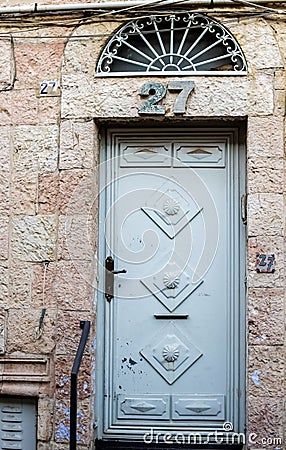 Old blue durty, dirty door with rusty and openwork a beautiful vintage background Stock Photo