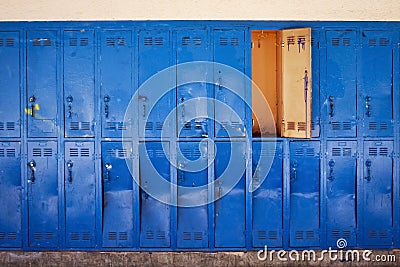 Old blue lockers with door open Stock Photo