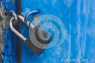 Old blue metal door with lock closed exit entrance, close up Stock Photo