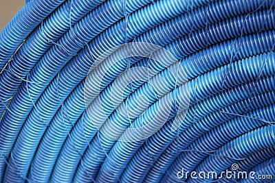 Old blue plastic hoses Stock Photo