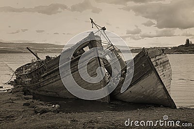 Old boads aground in Isle of Mull Stock Photo
