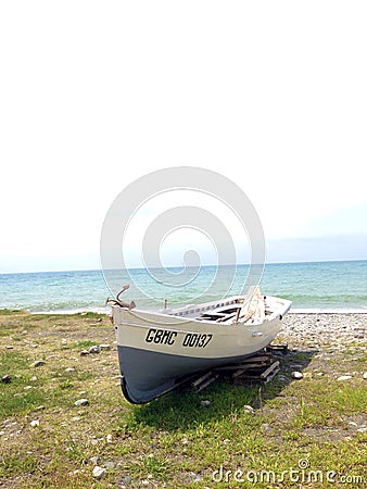 Old boat on the sea shore Editorial Stock Photo