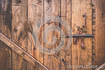 Old bolt open over wood door Stock Photo
