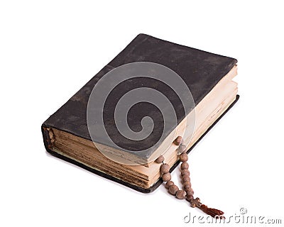 Book with church rosary isolate on a white background Stock Photo