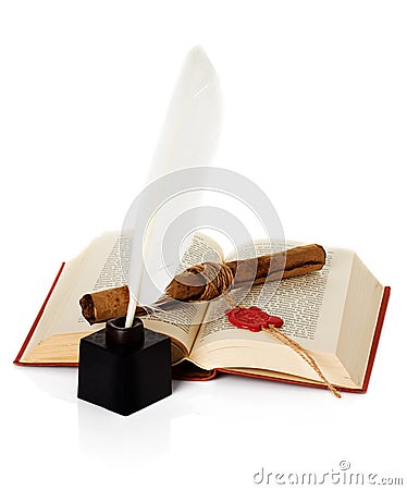 Old book with inkwell and quill pen Stock Photo