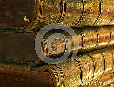Old book in the light of candles Stock Photo