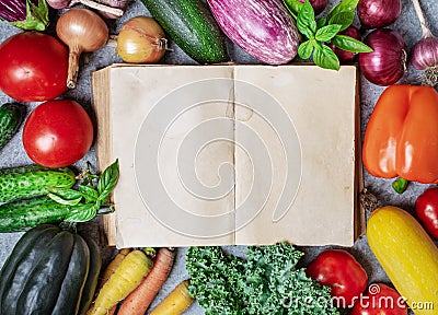 Old book and vegetables Stock Photo