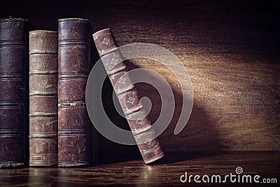 Old books on a library shelf background Stock Photo