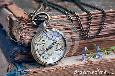 Old books and pocket watch Stock Photo