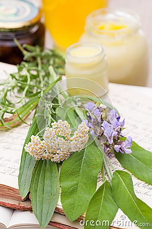 Old books with recipes, medicinal herbs and ointments Stock Photo