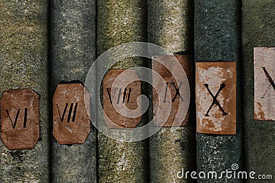 Old books with Roman numerals in the library Stock Photo