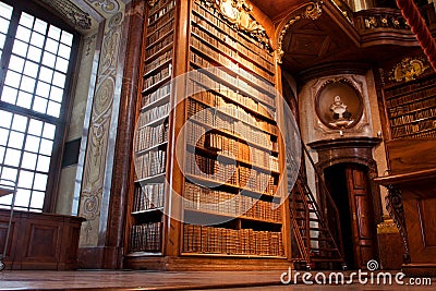 Old bookshelf inside the beautiful library Editorial Stock Photo