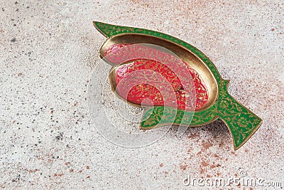 Old brass ashtray on concrete background Stock Photo