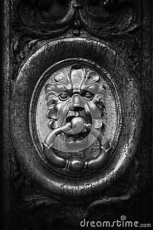 Old brass knocker in black and white Stock Photo