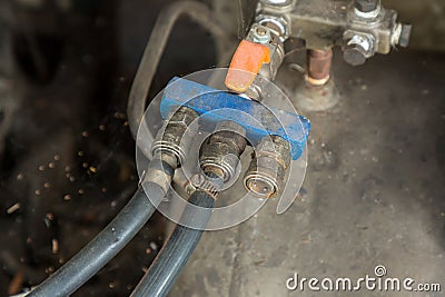 Old brass valves, air pumps. Air quick coupling, quick couple, air piping system in factory. Stock Photo