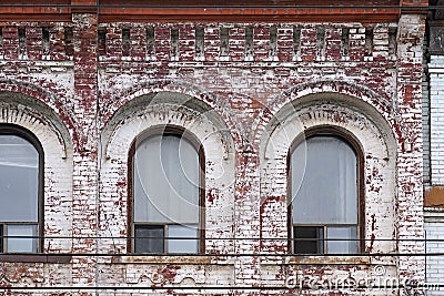 old brick apartment building with badly pealing paint Stock Photo