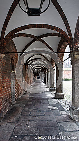 Old brick tunnel with lanterns, Market Square, Lubeck, Germany Stock Photo