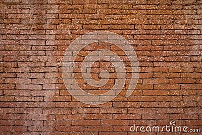 The old brick wall background exudes a rustic charm with weathered bricks and worn mortar telling stories of the past. Stock Photo