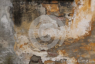 Old brick wall with cracked plaster. Background. Stock Photo