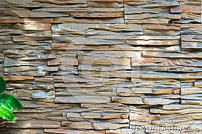 Old brick wall from a flat stone and green grass in the foreground. Stock Photo