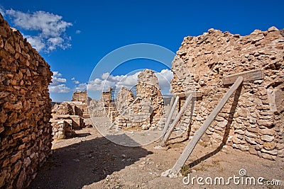 Old brick wall of historical city propped up by wooden props Stock Photo