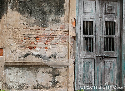 Old brick wall and wooden green door shabby Stock Photo