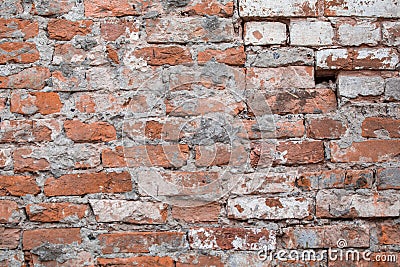Old brick wrecked wall biege grunge surface weathered concrete cement with holes, erosion and destruction. Texture, background Stock Photo