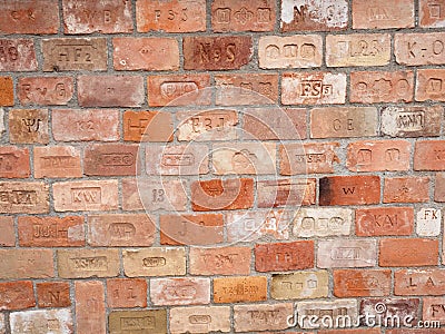 The old bricks wall build from branded bricks. An amazing collection Stock Photo
