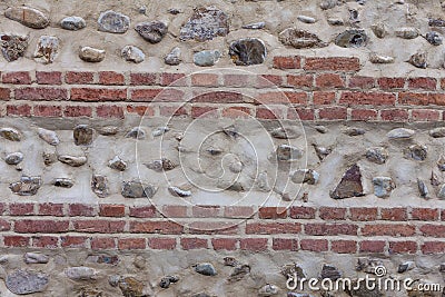 Old bricky wall with stones Stock Photo