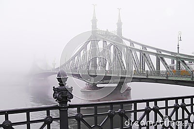 Old bridge in the fog. Mystical vision. Stock Photo