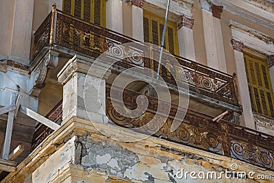 Old broken balcony on a old house with rust and ruined. Stock Photo