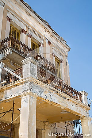 Old broken balcony on a old house with rust and ruined. Stock Photo